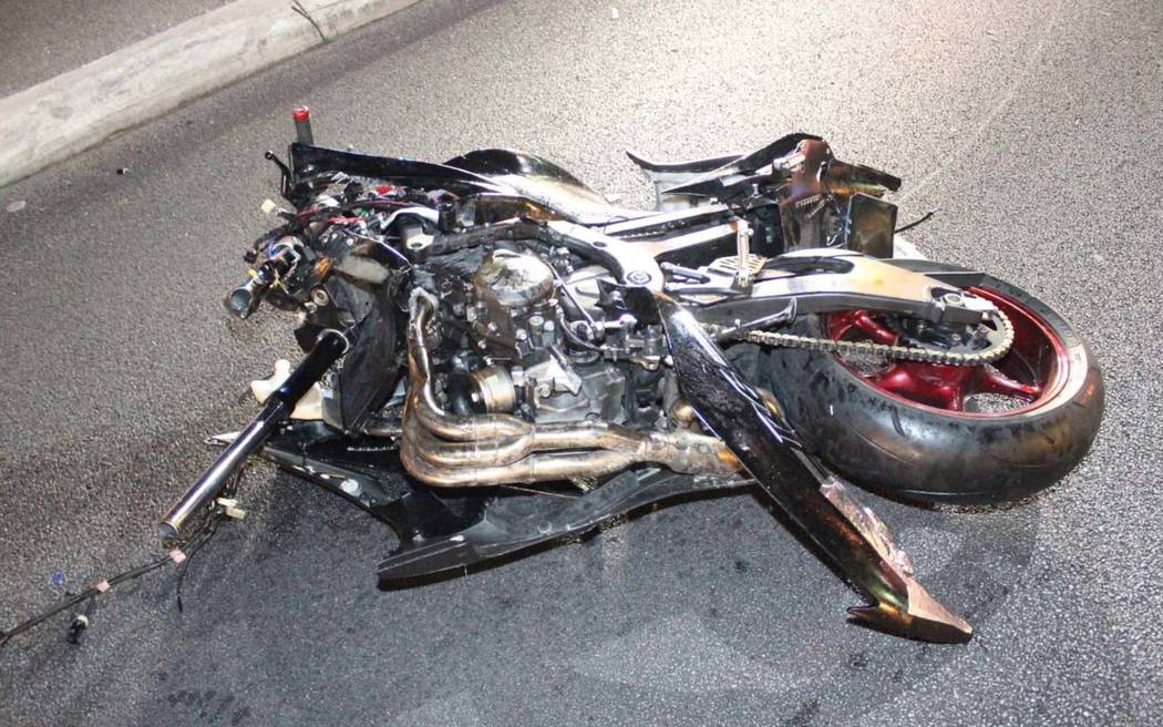 What’s left of a motorcyle involved in a collision with a Cadillac pick-up truck lies in the street at the northbound off-ramp from I-15 to Flamingo Road in Las Vegas early Sunday morning. ...