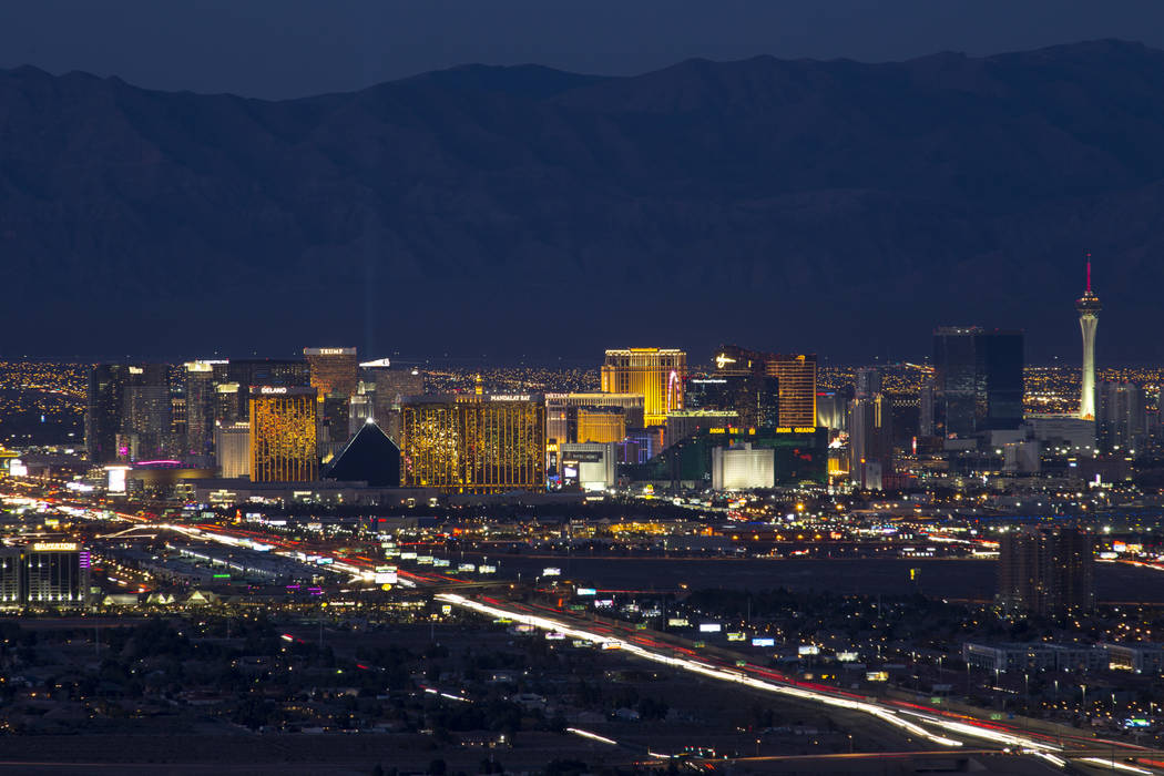 Traffic moves along Interstate 15 as Las Vegas casinos illuminate the city's skyline at dusk on Tuesday, Feb. 6, 2018. Richard Brian Las Vegas Review-Journal @vegasphotograph