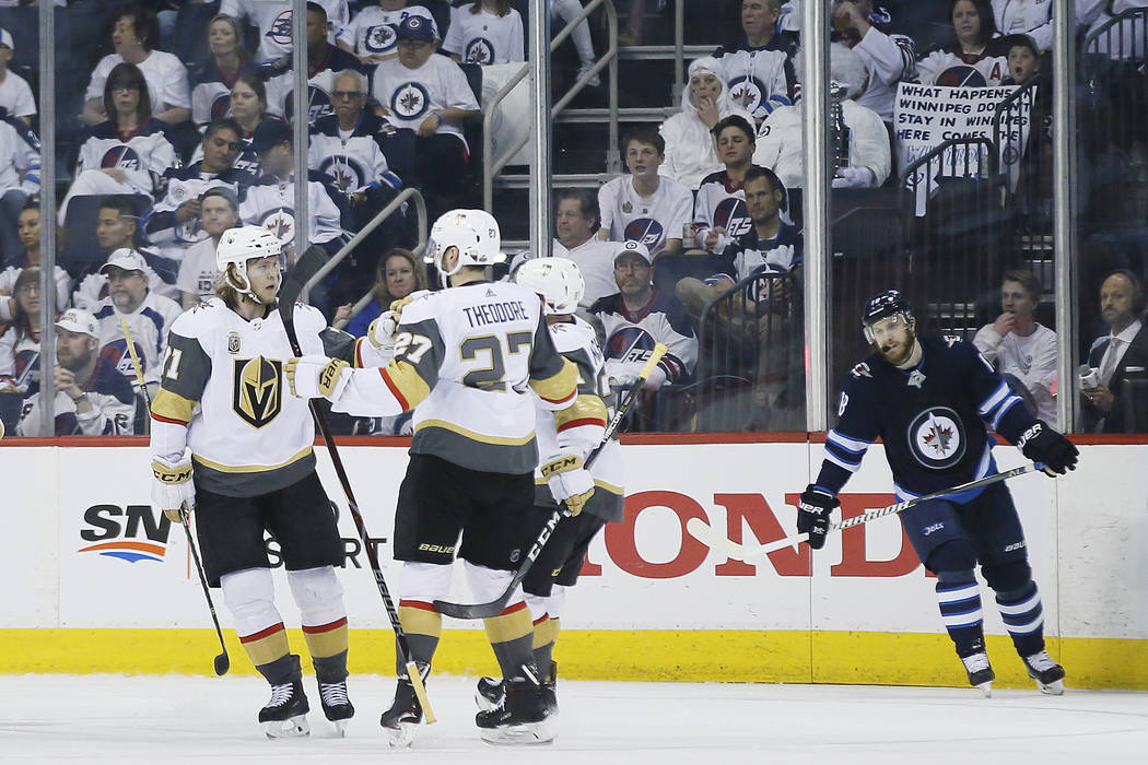 Vegas Golden Knights celebrate a goal by William Karlsson goal against the Winnipeg Jets during the second period of Game 1 of the NHL hockey playoffs Western Conference final, Saturday, May 12, 2 ...