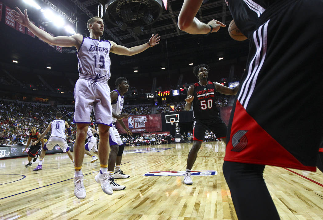 Portland Trail Blazers' RJ Hunter (28) throws the ball in to Portland Trail Blazers' Caleb Swanigan (50) during the NBA Summer League championship game against the Los Angeles Lakers at the Thomas ...