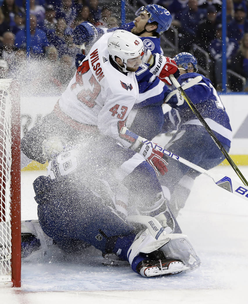 Washington Capitals right wing Tom Wilson (43) crashes into Tampa Bay Lightning goaltender Andrei Vasilevskiy (88) during the first period of Game 2 of the NHL Eastern Conference finals hockey pla ...
