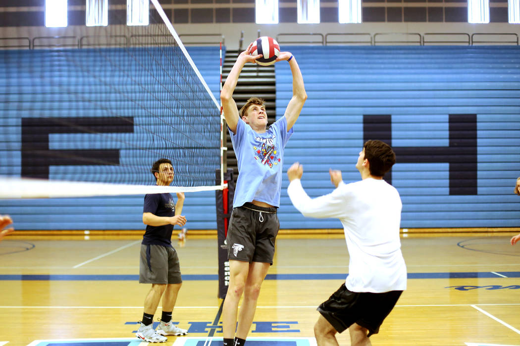 Caleb Stearman, 17, of the Foothill High School mens volleyball team, sets the ball for teammate Truss Erb during practice at Foothill High School in Henderson, Monday, May 14, 2018. Stearman is b ...