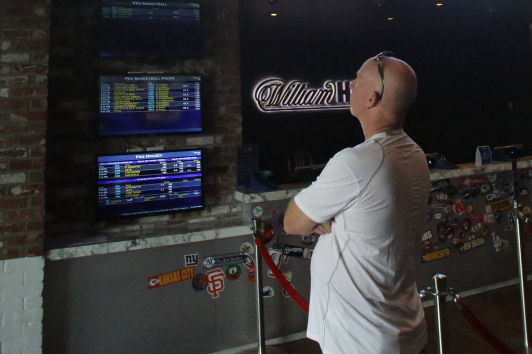 Gary Brown from Toronto checks the lines at the SLS Sports Book on Monday, May 14, 2018. Michael Quine/Las Vegas Review-Journal @Vegas88s