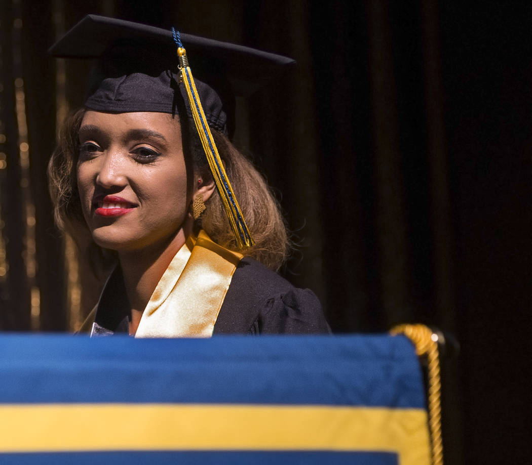 Niyat Teweldebrhan, a 28-year-old Eritrean refugee who survived war in her home country, waits on stage to receive her Masters of Science in medical health sciences from the College of O ...