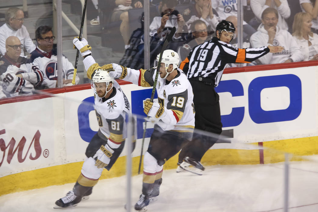 Vegas Golden Knights center Jonathan Marchessault (81) celebrates with Reilly Smith (19) after scoring against the Winnipeg Jets in first period in Game 1 of an NHL hockey third round playoff seri ...