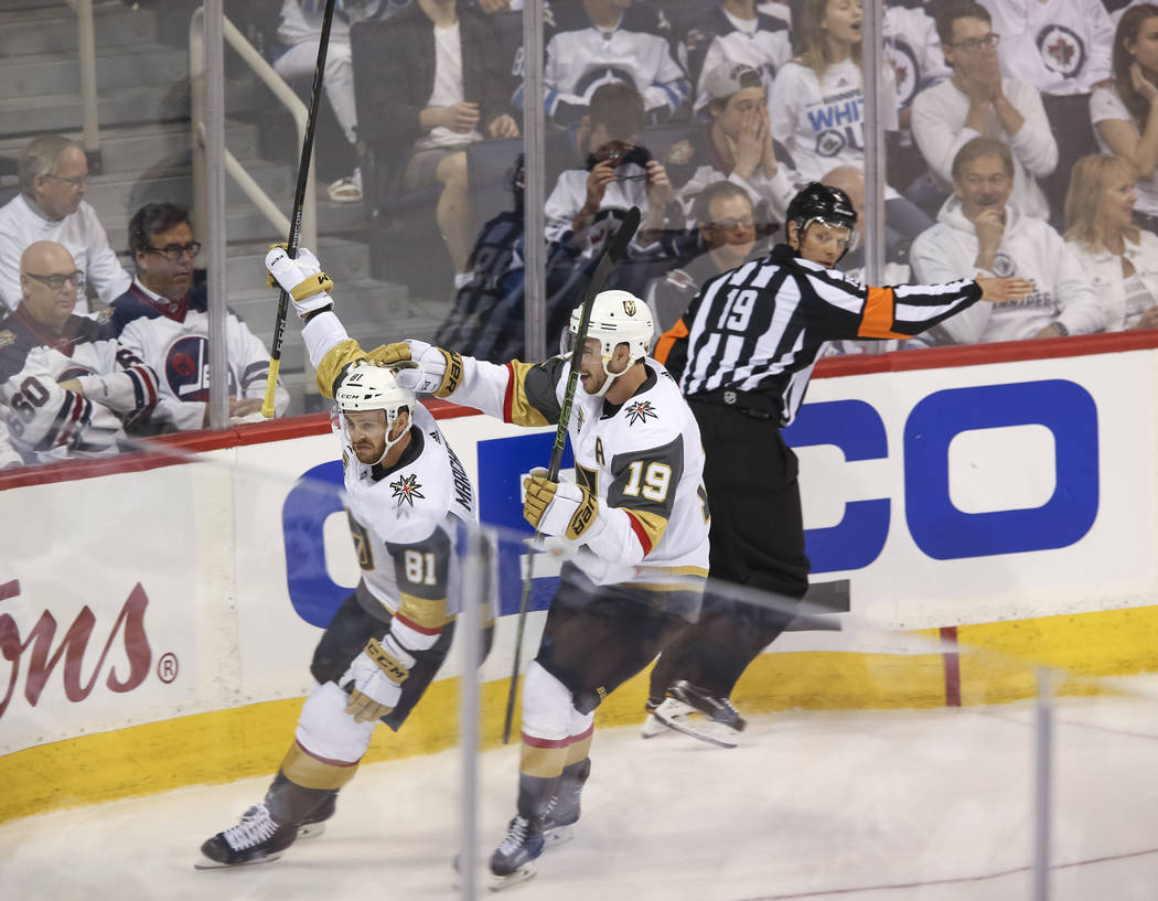 Vegas Golden Knights center Jonathan Marchessault (81) celebrates with Reilly Smith (19) after scoring against the Winnipeg Jets in first period in Game 1 of an NHL hockey third round playoff seri ...