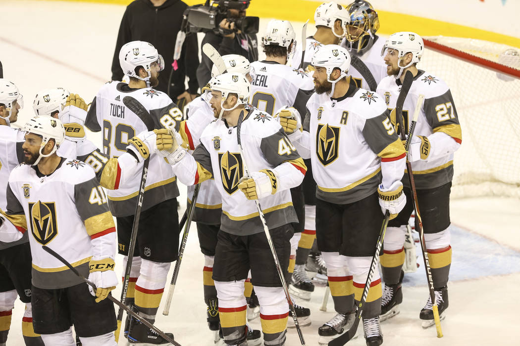 The Vegas Golden Knights celebrate their 3-1 victory over the Winnipeg Jets in Game 2 of an NHL hockey third round playoff series at the Bell MTS Place in Winnipeg, Canada, on Saturday, May 12, 20 ...