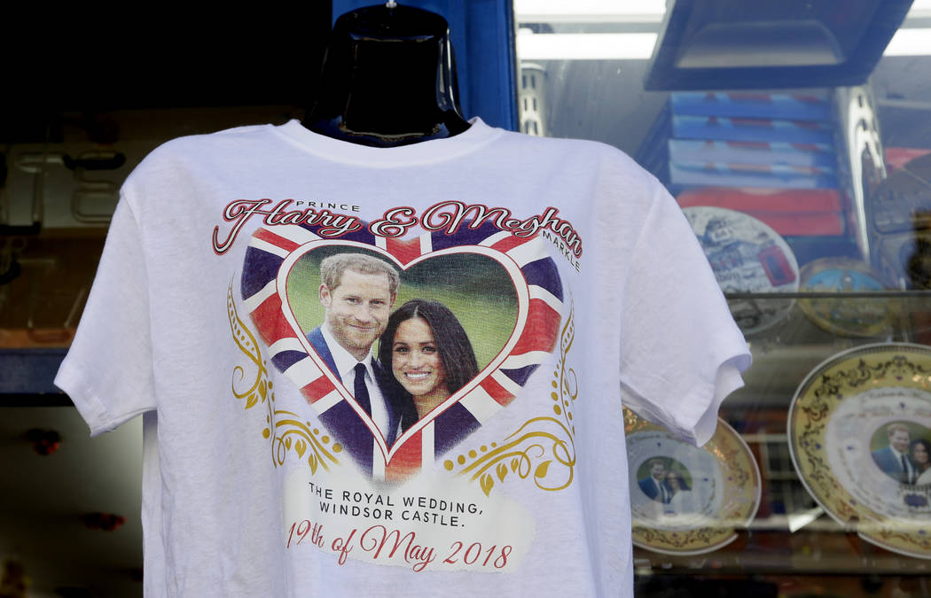 A T-shirt is seen for sale in Windsor, England, Monday, May 14, 2018. Preparations are being made in the town ahead of the wedding of Britain's Prince Harry and Meghan Markle that will take place ...