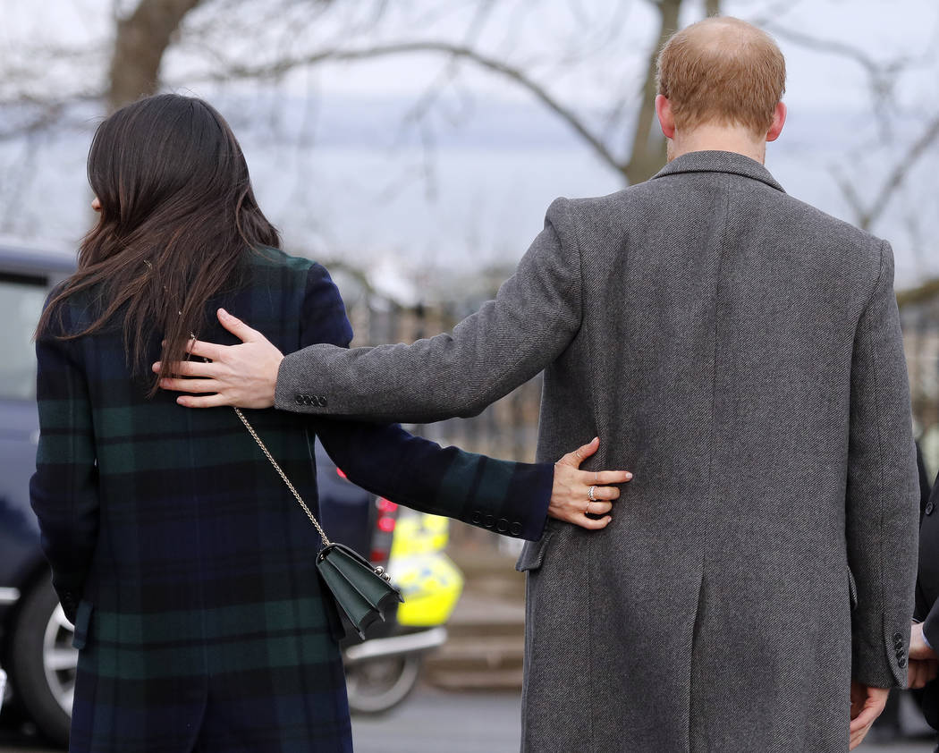 FILE - In this file photo dated Tuesday, Feb. 13, 2018, Britain's Prince Harry and his fiancee Meghan Markle arrive at Edinburgh Castle in Edinburgh, Scotland. Kensington Palace said Monday May 14 ...