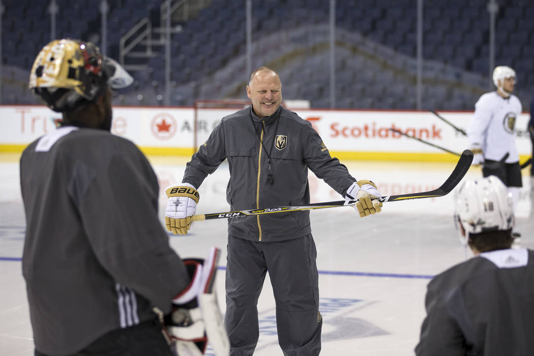 Vegas Golden Knights head coach Gerard Gallant talks to players during their morning skate ahead of Game 2 against the Winnipeg Jets at the Bell MTS Place in Winnipeg, Canada, on Monday, May 14, 2 ...