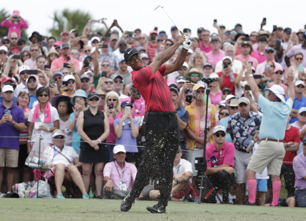 Tiger Woods hits from the third tee, during the final round of The Players Championship golf tournament, Sunday, May 13, 2018, in Ponte Vedra Beach, Fla. (AP Photo/Lynne Sladky)