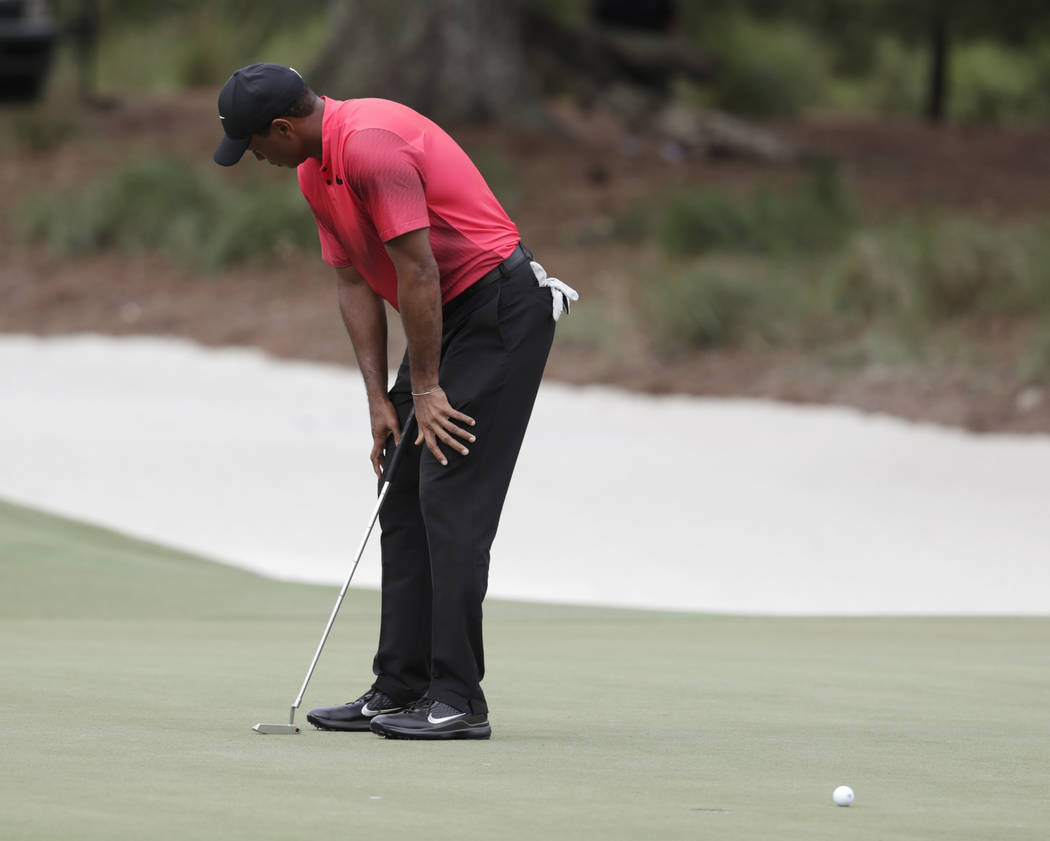 Tiger Woods looks away as he misses a putt on the 14 green, during the final round of The Players Championship golf tournament Sunday, May 13, 2018, in Ponte Vedra Beach, Fla. (AP Photo/Lynne Sladky)