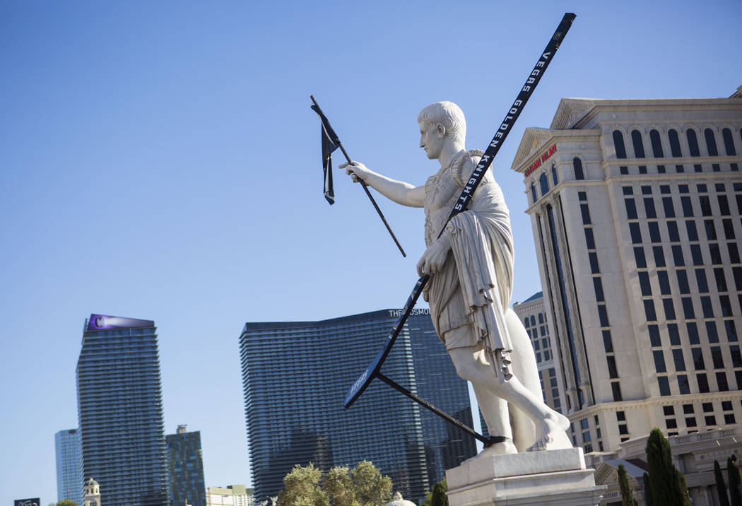 A statue of Julius Caesar is seen adorned with a Golden Knights flag and hockey stick outside of Caesars Palace in Las Vegas on Tuesday, May 15, 2018. Chase Stevens Las Vegas Review-Journal @csste ...