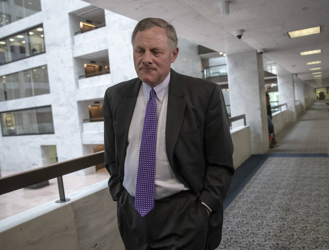 Senate Intelligence Committee Chairman Richard Burr, R-N.C., goes behind closed doors as members of the Senate Intelligence Committee arrive to meet with former national security chiefs on Russian ...