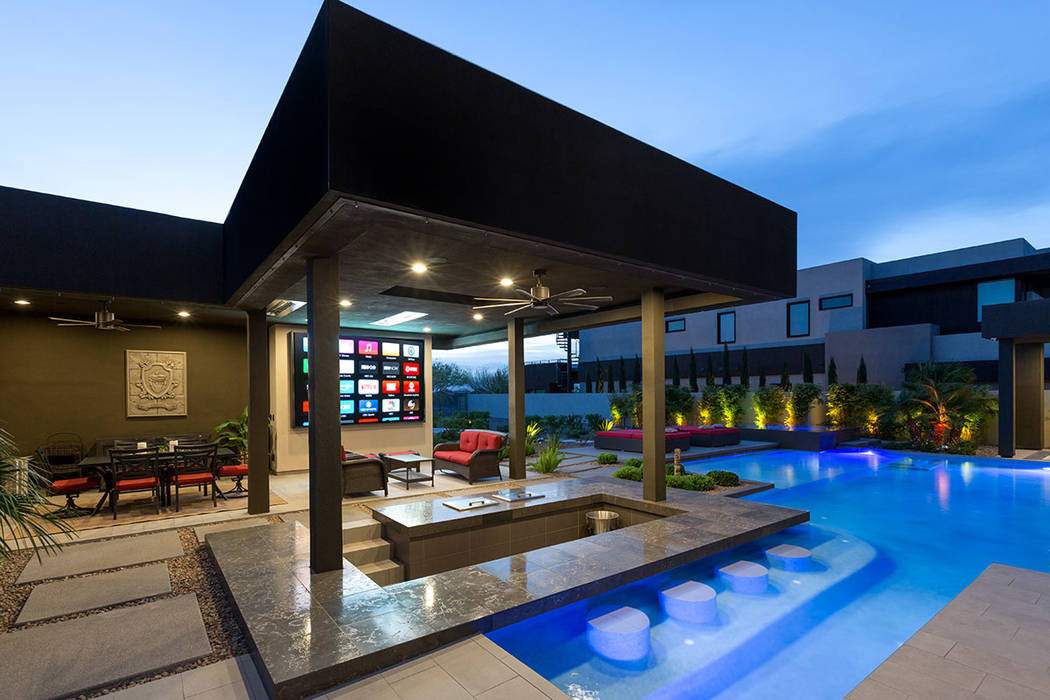 The pool has a swim-up bar for guests who wish to watch movies or sports on  the 132-inch, custom HD/LED digital display TV. (The Red Luxury Real  Estate) | Las Vegas Review-Journal