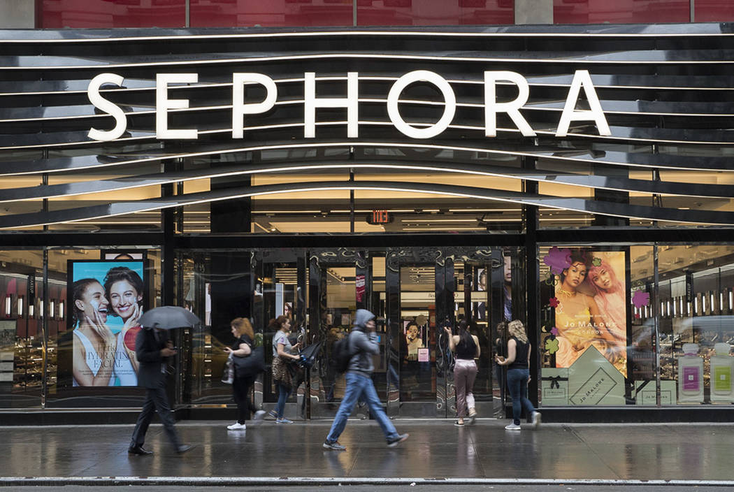 Pedestrians walk past a Sephora store, Wednesday, May 16, 2018, in New York. (AP Photo/Mary Altaffer)