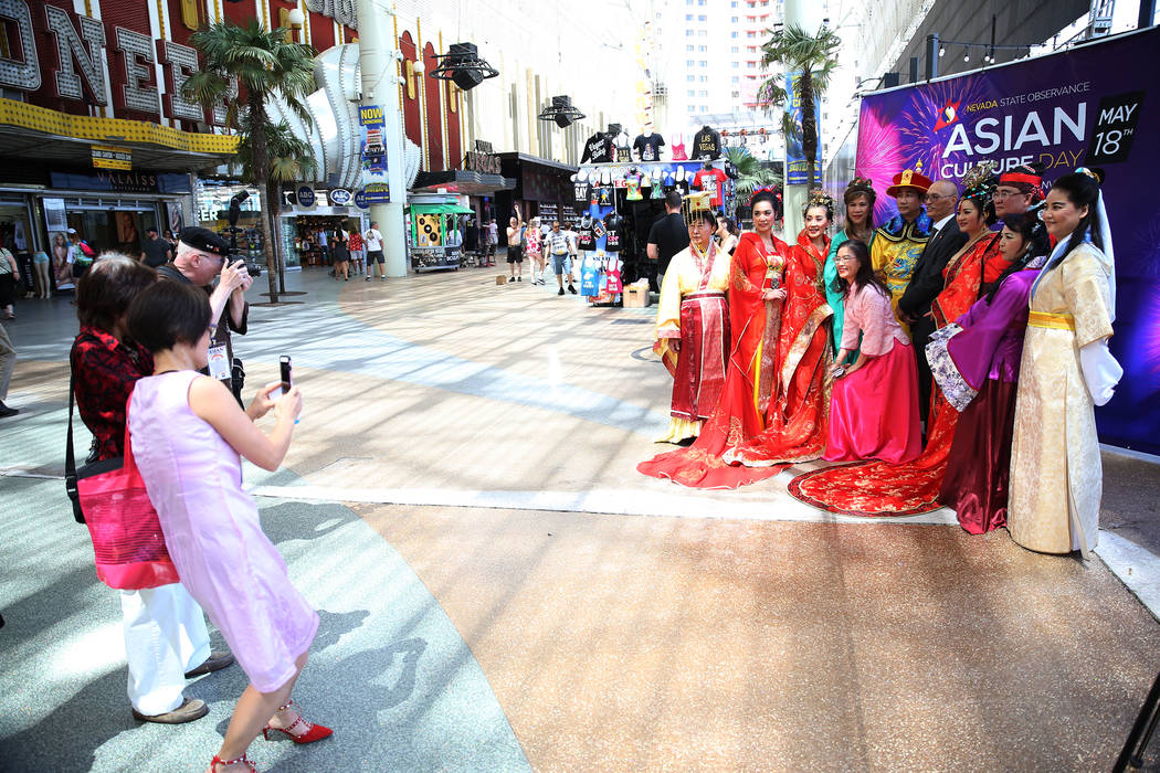 People photograph performers during the Asian Culture Day Celebration at Fremont Street Experience in Las Vegas, Wednesday, May 16, 2018. Erik Verduzco Las Vegas Review-Journal @Erik_Verduzco