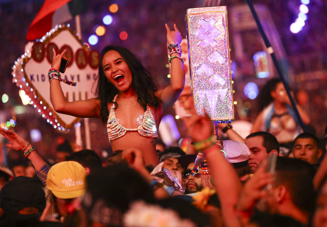 Attendees cheer while waiting for Post Malone at the Cosmic Meadow stage during the third day of the Electric Daisy Carnival at the Las Vegas Motor Speedway in Las Vegas on Sunday, May 20, 2018. C ...