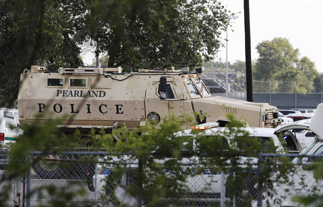 A Pearland Police armored vehicle stands ready in front of Santa Fe High School in Santa Fe, Texas, in response to a shooting on Friday morning, May 18, 2018. (Kevin M. Cox/The Galveston County Da ...