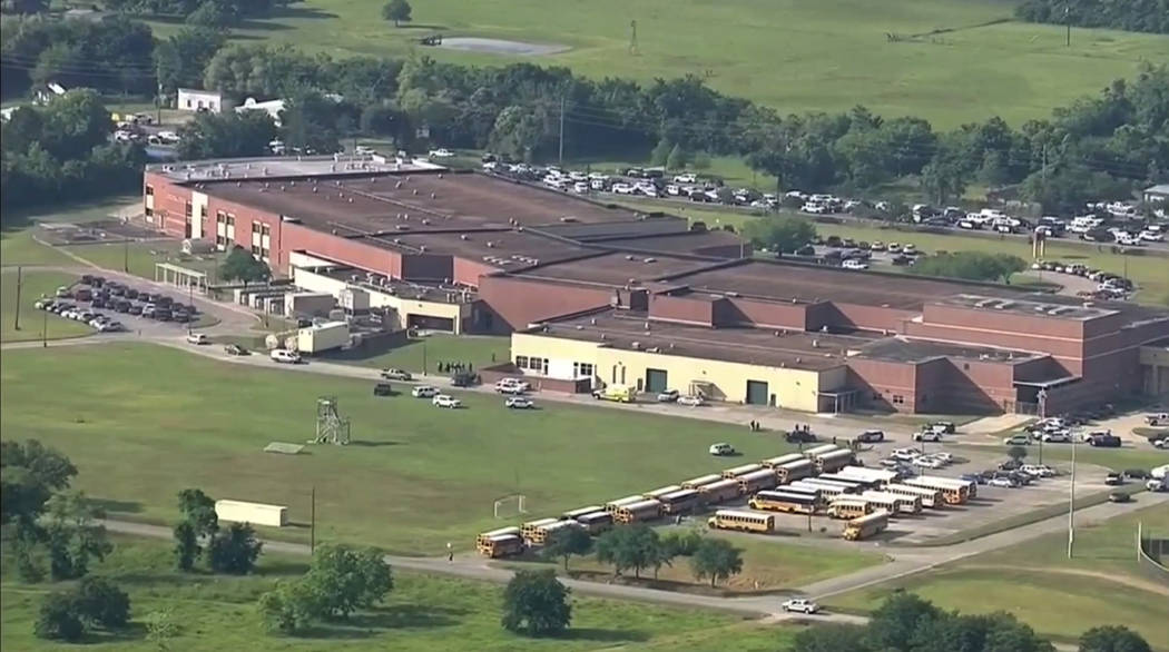 This image taken from video shows the campus of Santa Fe High School, Friday, May 18, 2018, in Santa Fe, Texas. Law enforcement officers responded to the school near Houston after an active shoote ...