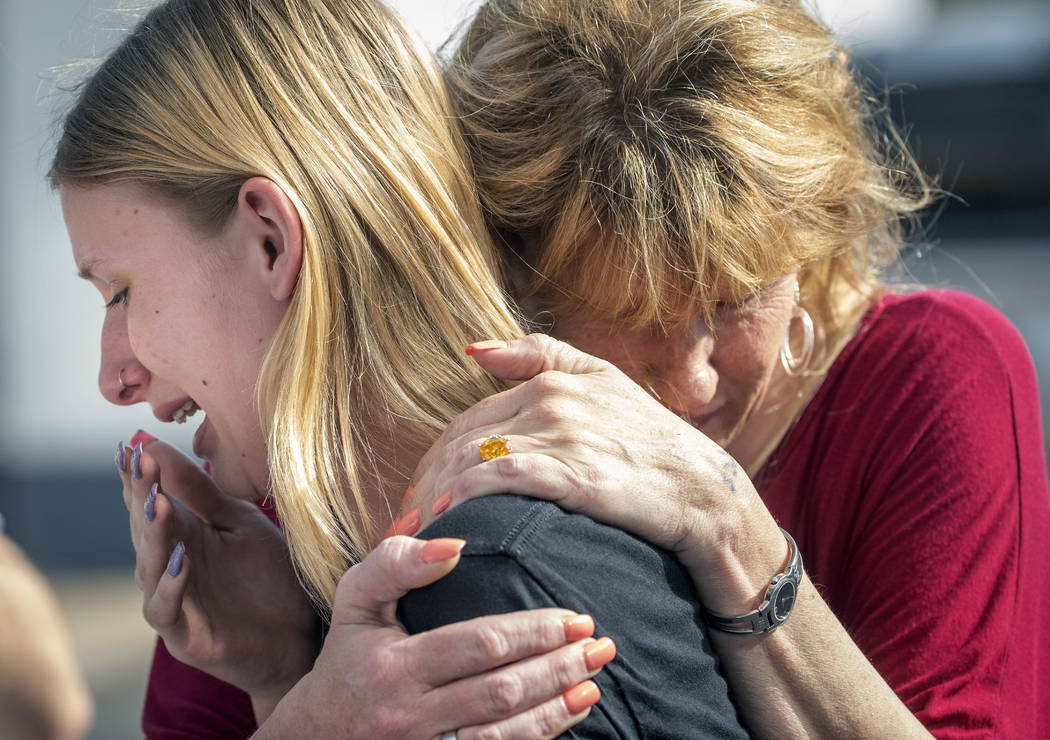 Santa Fe High School student Dakota Shrader is comforted by her mother Susan Davidson following a shooting at the school on Friday, May 18, 2018, in Santa Fe, Texas. Shrader said her friend was sh ...