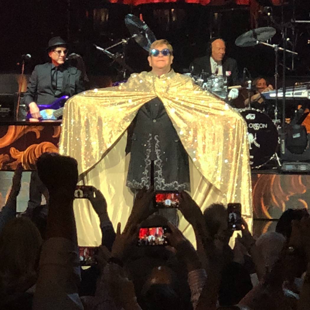 Elton John is shows off his golden cape at the beginning of his final performance of "Million Dollar Piano" at the Colosseum at Caesars Palace on Thursday, May 17, 2018. (John Katsilometes/Las Veg ...