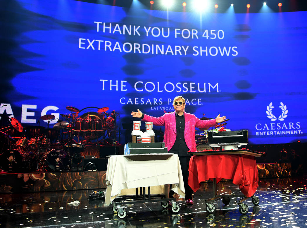 Elton John is shown with a pair of cakes at the close of his final performance of "Million Dollar Piano" at the Colosseum at Caesars Palace on Thursday, May 17, 2018. (Denise Truscello)