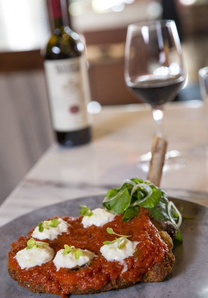 Veal chop parmigiana served with watercress, pickled onions, tomatoes and burrata cheese Masso Osteria inside Red Rock Casino in Las Vegas on Monday, May 21, 2018. Richard Brian Las Vegas Review-J ...