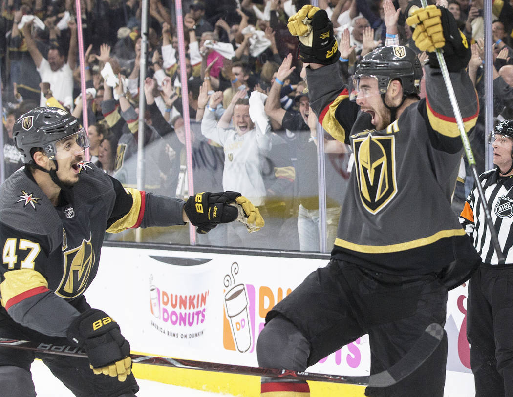 Golden Knights right wing Reilly Smith (19) celebrates with Luca Sbisa (47) after scoring a third period goal during game four of Las Vegas' NHL Western Conference Finals matchup with Winnipeg on ...