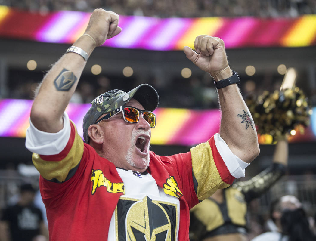 Golden Knights fans cheer for their home town team in the third period during game four of Las Vegas' NHL Western Conference Finals matchup with the Winnipeg Jets on Friday, May 18, 2018, at T-Mob ...