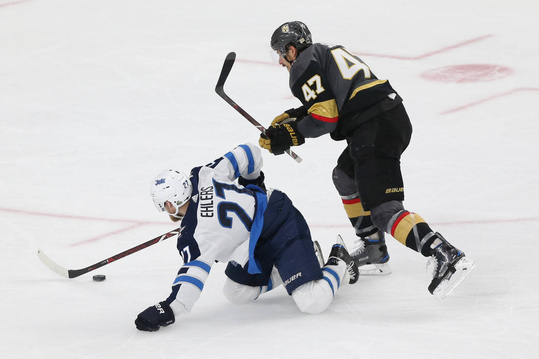 Vegas Golden Knights defenseman Luca Sbisa (47) defends against Winnipeg Jets left wing Nikolaj Ehlers (27) during the second period in Game 4 of the Western Conference Final at T-Mobile Arena in ...