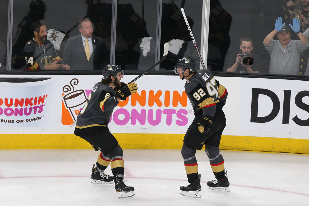 Vegas Golden Knights left wing Tomas Nosek (92) celebrates his score with defenseman Colin Miller (6) against the Winnipeg Jets during the second period in Game 4 of the Western Conference Final a ...