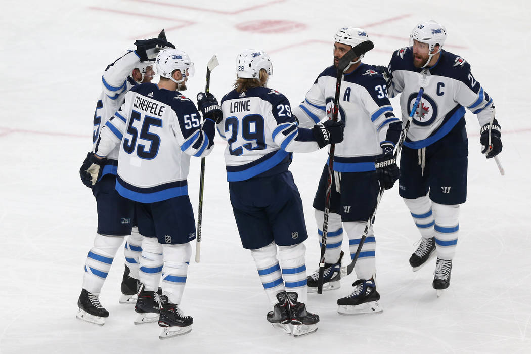 Winnipeg Jets right wing Patrik Laine (29) celebrates a score with his team against the Vegas Golden Knights during the second period in Game 4 of the Western Conference Final at T-Mobile Arena in ...
