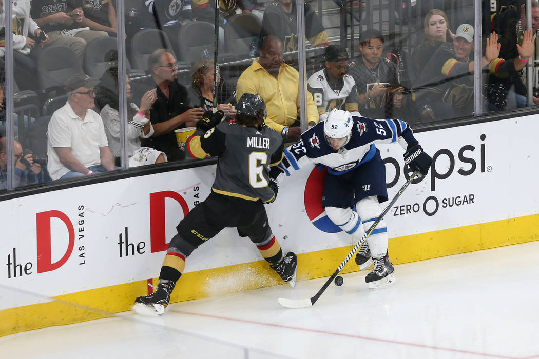 Vegas Golden Knights defenseman Colin Miller (6) defends against Winnipeg Jets center Jack Roslovic (52) during the second period in Game 4 of the Western Conference Final at T-Mobile Arena in Las ...