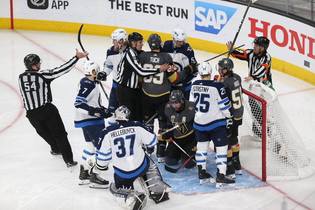 A scuffle breaks after a play by the Vegas Golden Knights against the Winnipeg Jets during the second period in Game 4 of the Western Conference Final at T-Mobile Arena in Las Vegas, Friday, May 1 ...