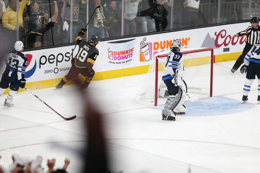 Vegas Golden Knights right wing Reilly Smith (19) celebrates his score against Winnipeg Jets goaltender Connor Hellebuyck (37) during the third period in Game 4 of the Western Conference Final at ...