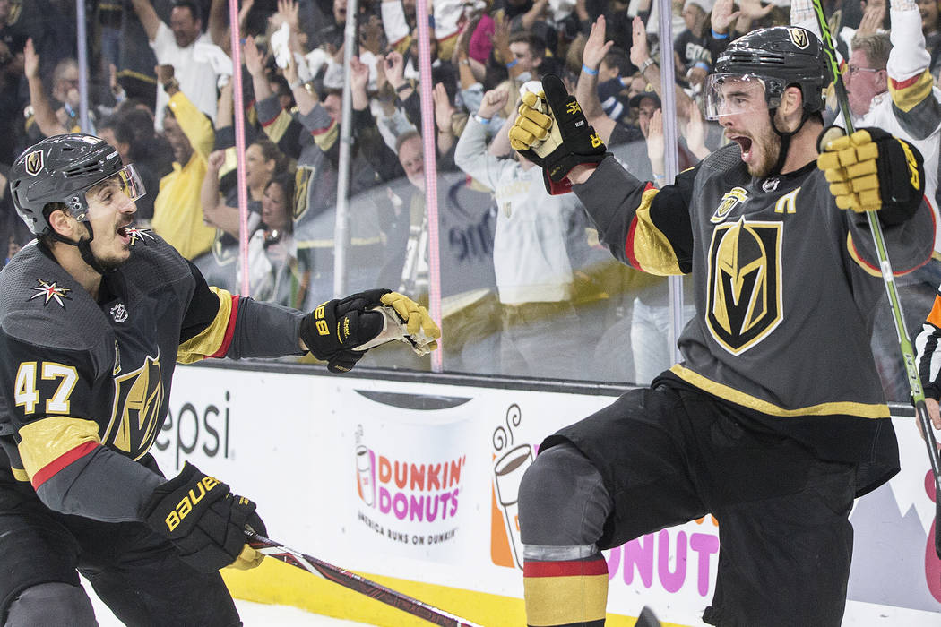 Golden Knights right wing Reilly Smith (19) celebrates with Luca Sbisa (47) after scoring a third period goal during game four of Las Vegas' NHL Western Conference Finals matchup with Winnipeg on ...