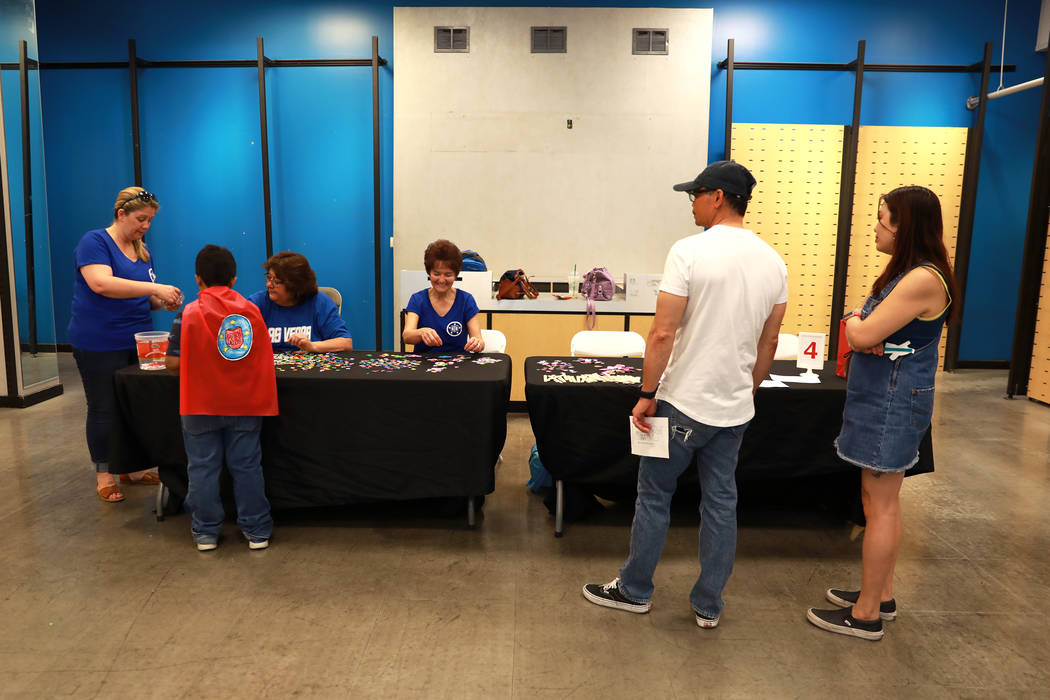 Families attend the Reading Rangers Summer Reading Program at Boulevard Mall in Las Vegas on Saturday, May 19, 2018. Students were given the opportunity to meet Reading Rangers superhero character ...