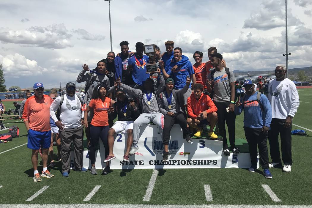 Bishop Gorman's boys track and field team poses with the Class 4A state championship trophy at Carson High School on Saturday afternoon. Sam Gordon/Las Vegas Review-Journal.
