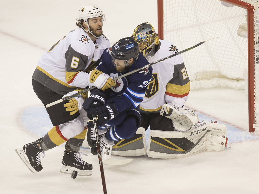 Golden Knights defenseman Colin Miller (6) collides with Jets left wing Nikolaj Ehlers (27) in the first period during game five of the NHL Western Conference Finals on Sunday, May 20, 2018, at Be ...