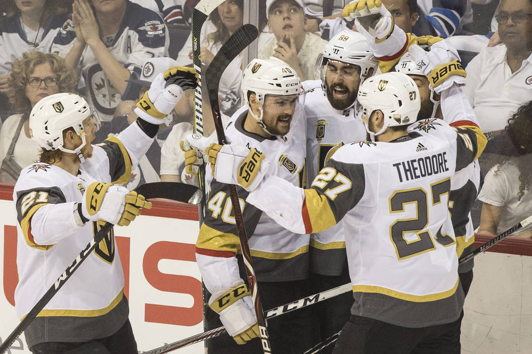 The Golden Knights celebrate after right wing Alex Tuch (89) scored a first period goal during game five of the NHL Western Conference Finals on Sunday, May 20, 2018, at Bell MTS Place, in Winnipe ...