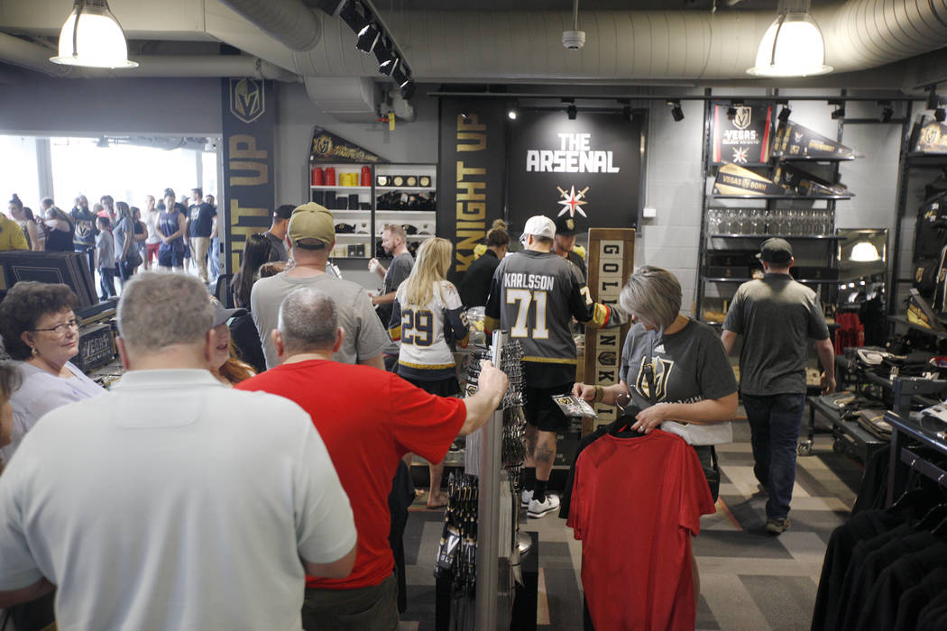 People line up to purchase the western conference championship shirts and other Golden Knights merchandise at the Arsenal retail store at the City National Arena in Las Vegas, Sunday, May 20, 2018 ...