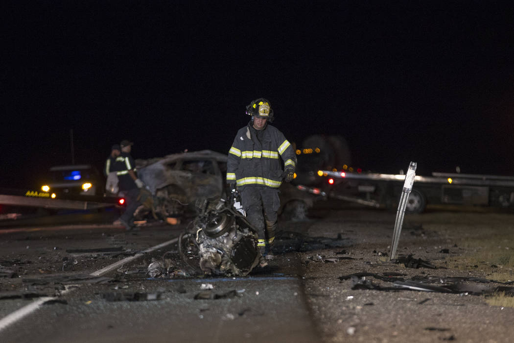 Workers at the scene of the multi fatality crash on U.S. Highway 95, near Amargosa Valley in Nye County, Sunday, May 20, 2018. (Rachel Aston Las Vegas Review-Journal @rookie__rae)