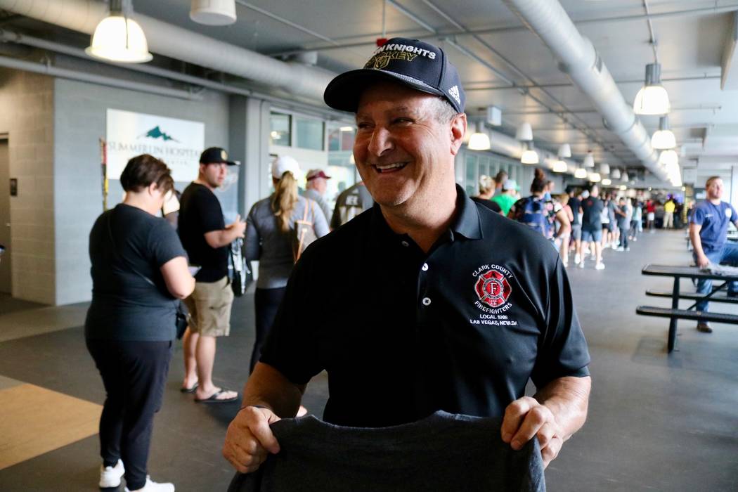 Clark County Fire Department engineer Mark Lepino holds a Knights-themed fire department shirt at City National Arena in Las Vegas, Monday, May 21, 2018. Lepino and others began selling shirts bef ...