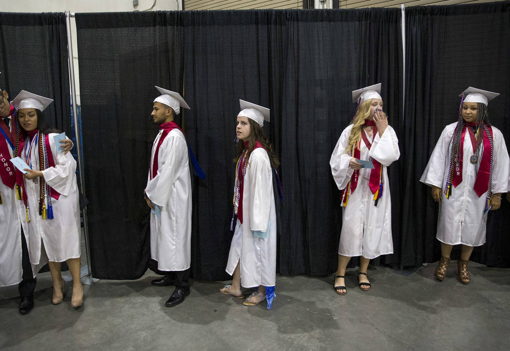 Jessica Lindley, center, stands in line before the start of her commencement ceremony at the Orleans Arena in Las Vegas on Thursday, May 24, 2018. Richard Brian Las Vegas Review-Journal @vegasphot ...