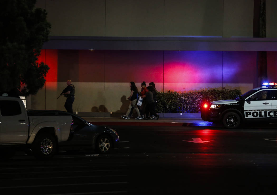 Police escort people outside of Sears at the Boulevard Mall in Las Vegas on Thursday, May 17, 2018. Andrea Cornejo Las Vegas Review-Journal @drea_cornejo
