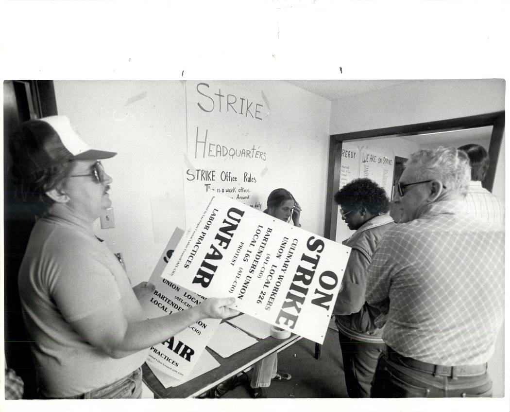 Signs are handed out at strike headquarters during a Culinary union strike in 1984. (Wayne Kodey/Las Vegas Review-Journal)