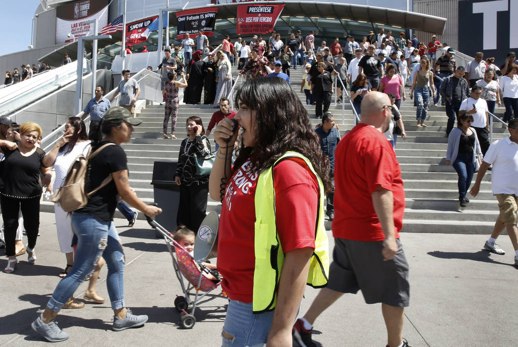 Jenifer Murias, volunteer organizer, shouts slogans as culinary and bartender union workers leave the Thomas & Mack Center in Las Vegas on Tuesday, May 22, 2018, after voting whether they want to ...