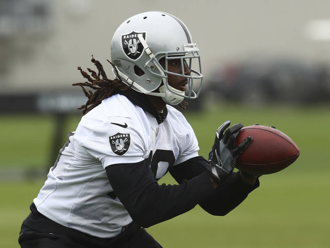 Oakland Raiders' Isaac Whitney makes a catch during NFL football practice on Tuesday, May 22, 2018, at the team's training facility in Alameda, Calif. (AP Photo/Ben Margot)