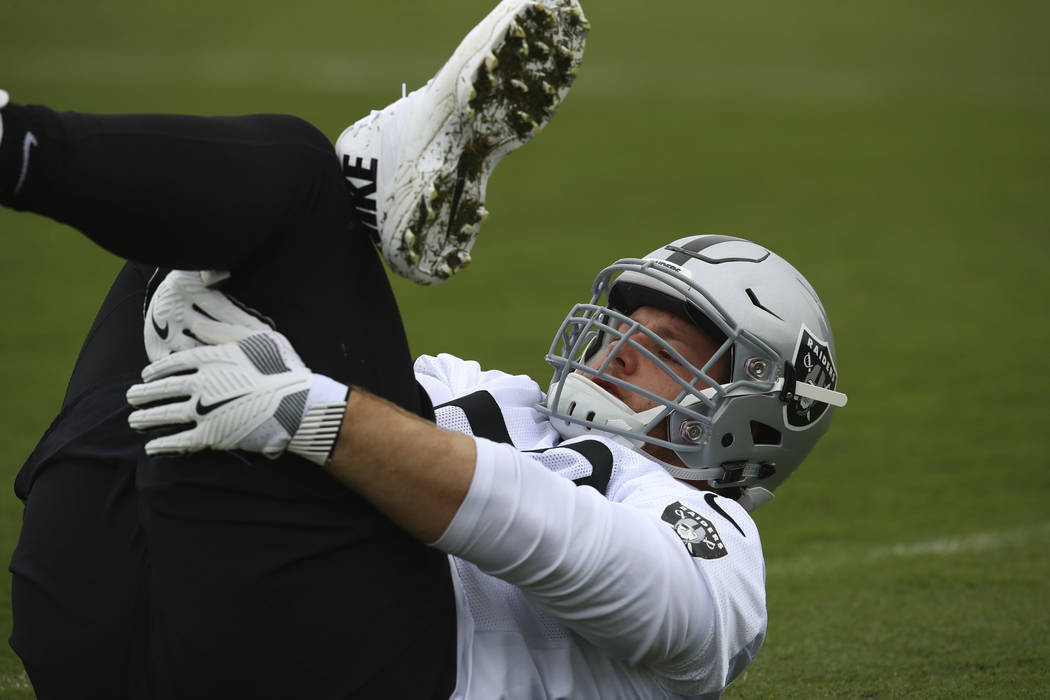 Oakland Raiders' Cameron Hunt stretches during NFL football practice on Tuesday, May 22, 2018, at the team's training facility in Alameda, Calif. (AP Photo/Ben Margot)